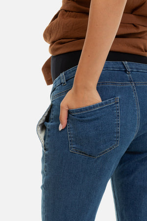 Elastyczne niebieskie dżinsy ciążowe