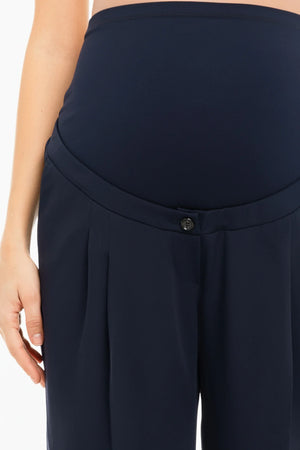 Granatowe, rozkloszowane spodnie ciążowe z zakładkami