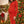 fitted_red_maternity_dress_in_front_of_christmas_tree